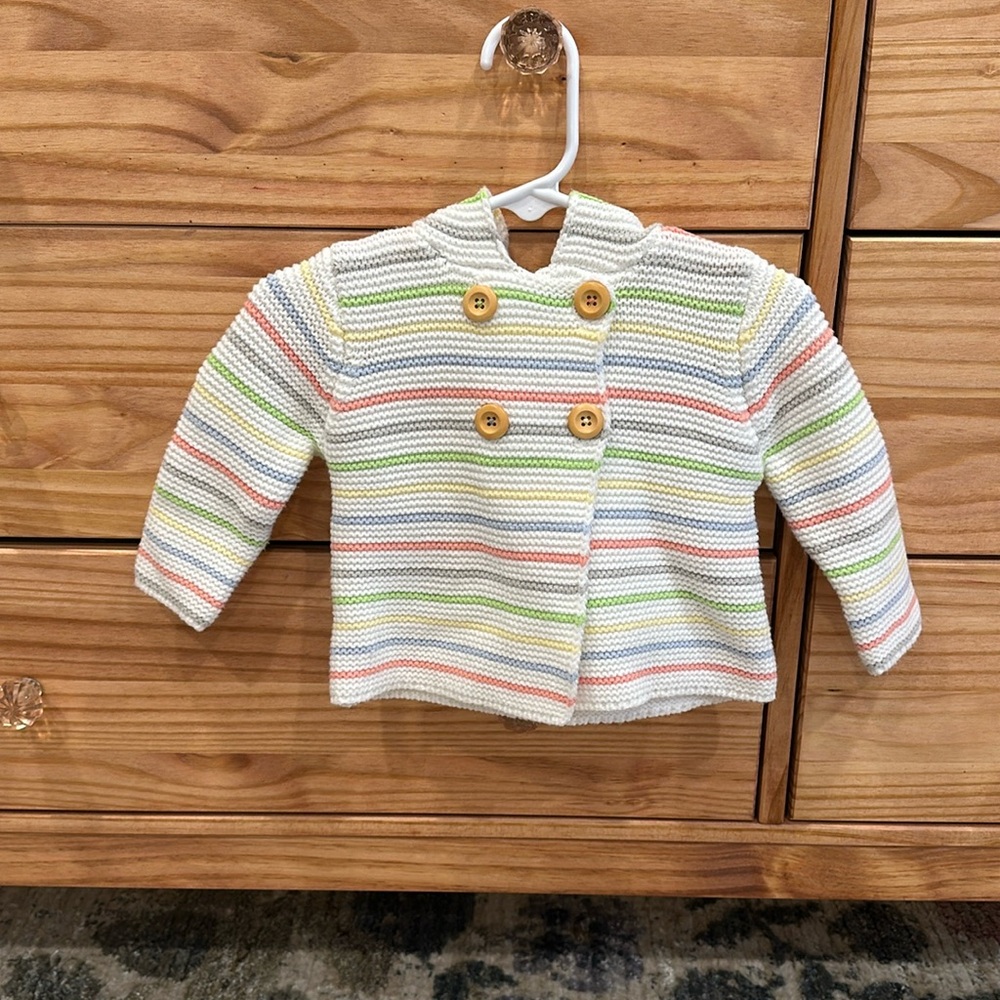 Knitted baby jacket with hood